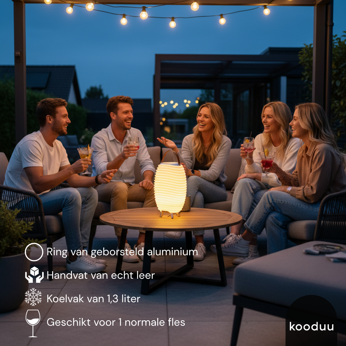 Group of people sitting around a table with a kOODU SYNERGY 35 COOLER LAMP on a patio at night, featuring text about a product.