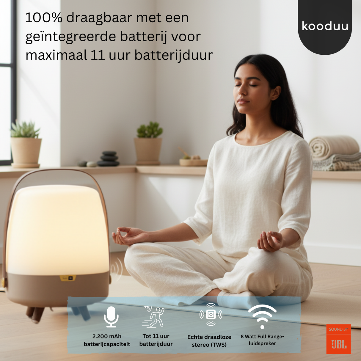 Woman meditating in a modern living room with a portable device and JBL branding.