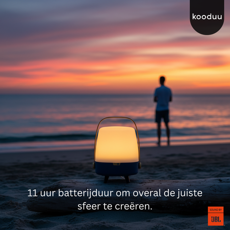 Person standing on a beach at sunset with a lit lantern and 'kooduu' branding.