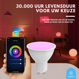 Smart light bulb with smartphone app control in a living room setting, highlighting color-changing capabilities.