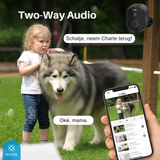 Dog with child and smartphone showing two-way audio app, with 'WOOX' branding.