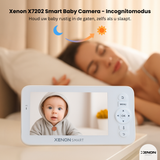Xenon X7202 Smart Baby Camera with a baby on the screen, displayed in front of a sleeping person.