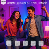 Two people singing into microphones in a room with RGB lighting, featuring Xenon smart Wi-Fi RGB bulb advertisement.